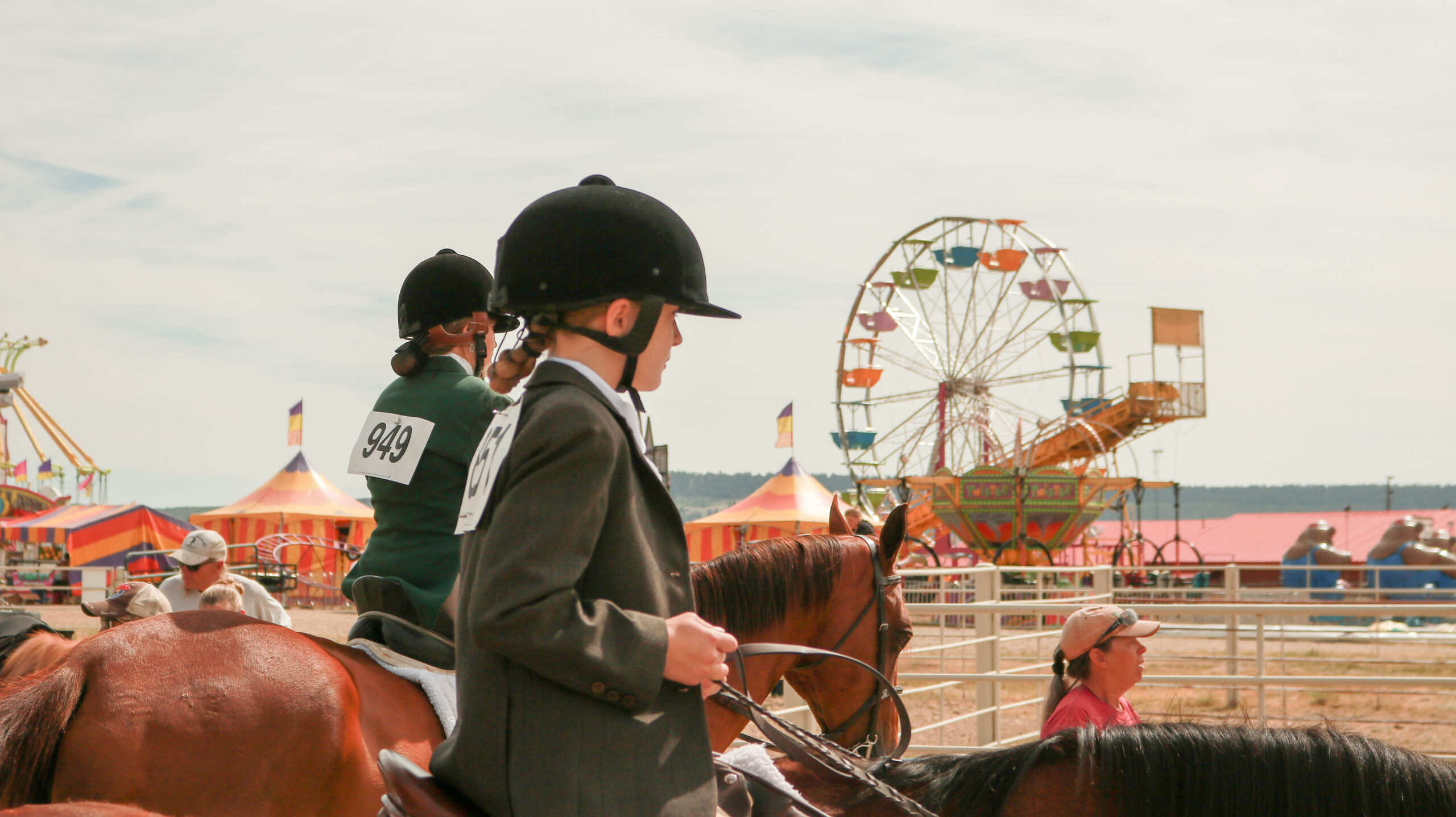 Horse Show Contestants at the Park County Fair with the Carnival in the background