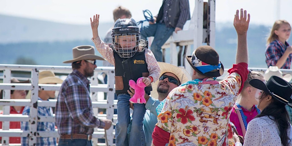 a girl celebrates her mutton bustin ride